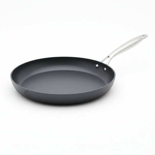 Low profile non-stick crepe pan with flat cooking surface on white studio background