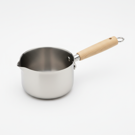 Mini non-stick milk pan with pour spout on white background