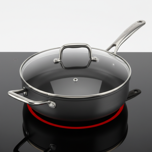 Non-stick deep saute pan with tempered glass lid on white studio background
